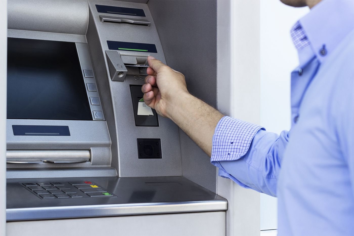 Customer withdrawing cash from an ATM